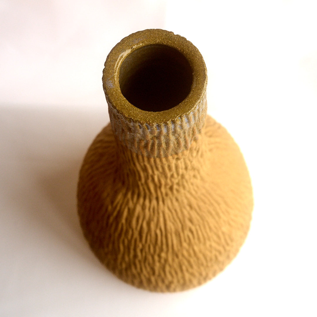 Raw fluted red vase